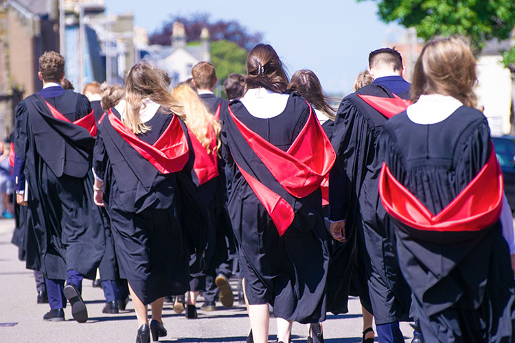 Graduating students walking along North Street