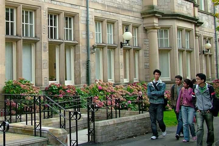 Students walk by one of the University buildings