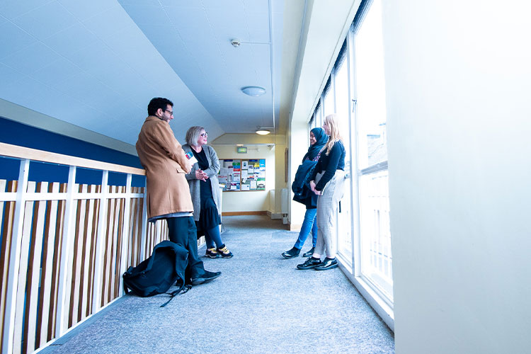 Students standing in hallway in School of Modern Languages